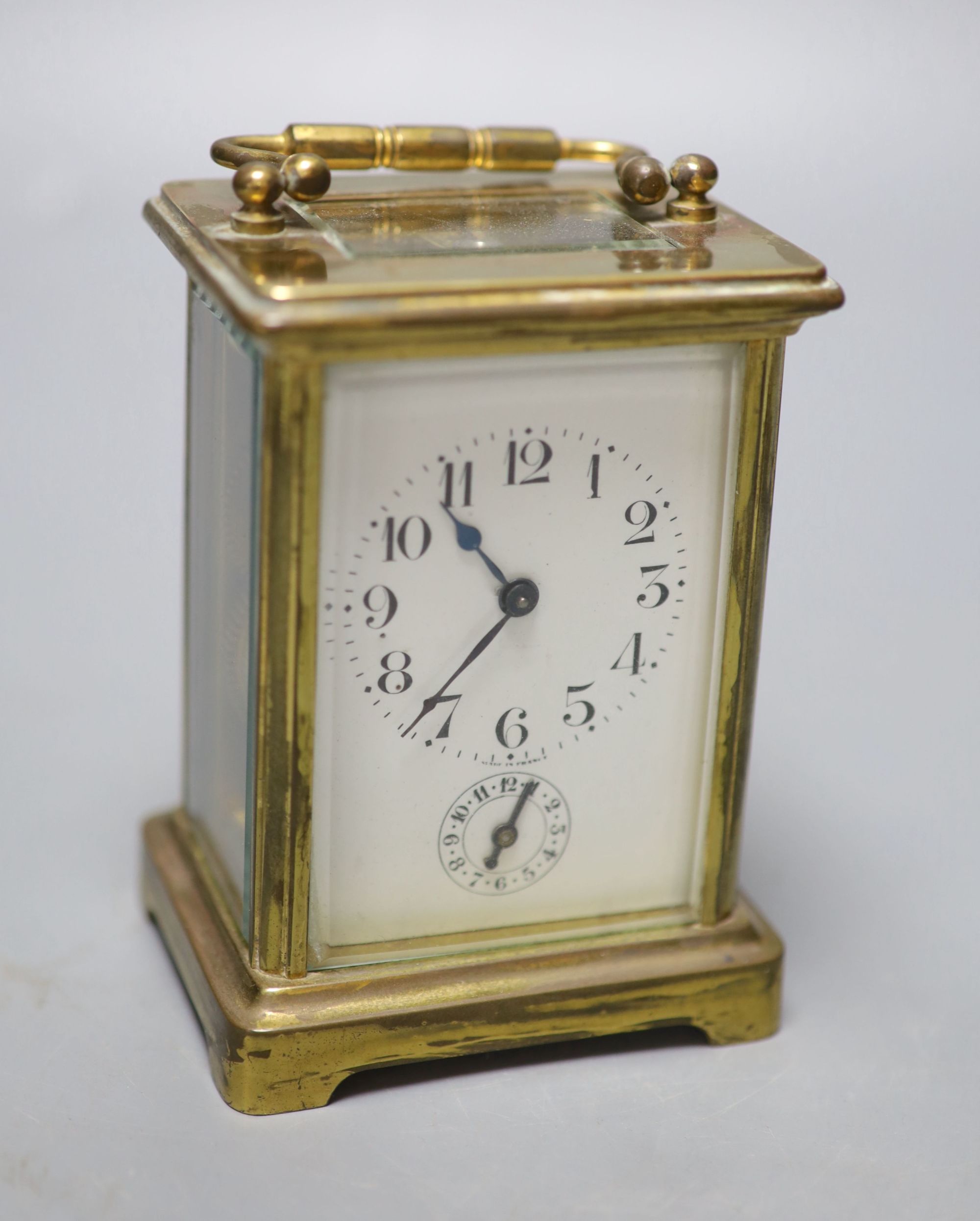 A late 19th century French brass cased eight day carriage timepiece with incorporated alarm, height 12cm